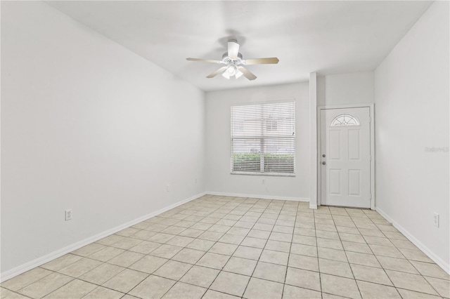 foyer with a ceiling fan and baseboards