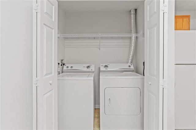 laundry room featuring washer and dryer and laundry area