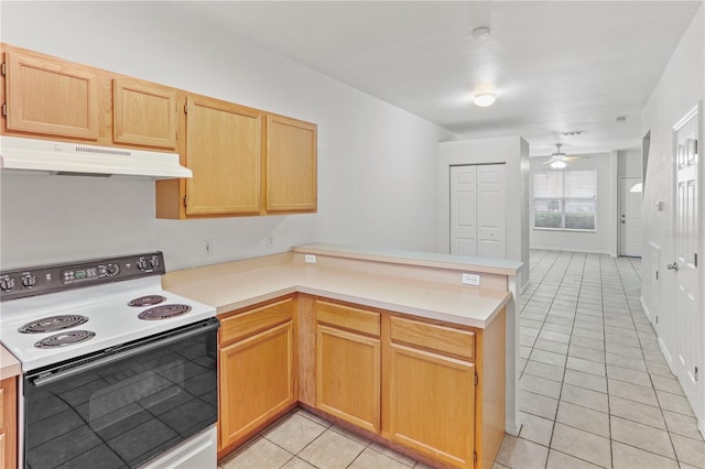 kitchen featuring light tile patterned floors, light countertops, electric range, a peninsula, and under cabinet range hood