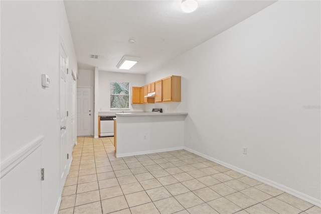 kitchen with white dishwasher, under cabinet range hood, a peninsula, baseboards, and light countertops