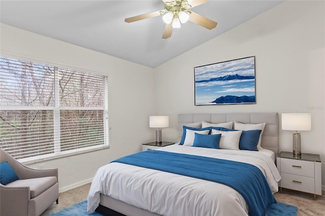 bedroom featuring ceiling fan, baseboards, vaulted ceiling, and carpet flooring