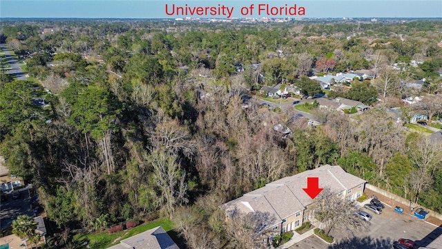 birds eye view of property with a forest view