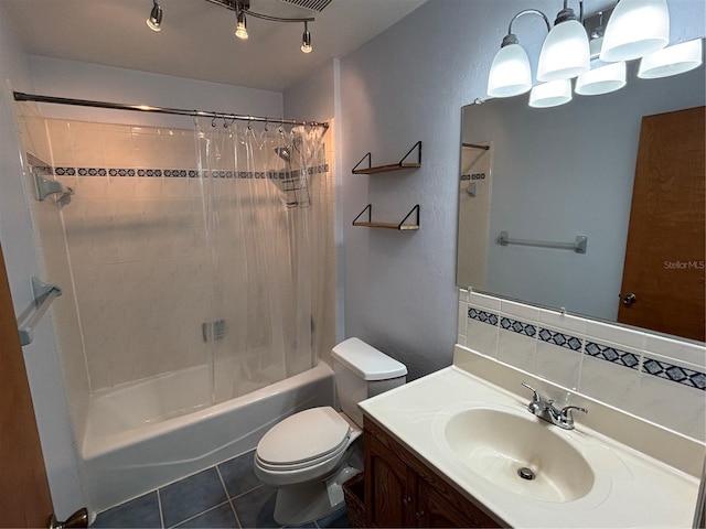 bathroom featuring tasteful backsplash, toilet, shower / bath combo with shower curtain, vanity, and tile patterned flooring