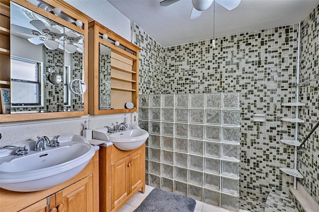 full bathroom featuring a ceiling fan, a sink, and walk in shower