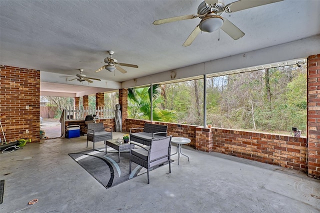 sunroom / solarium with ceiling fan