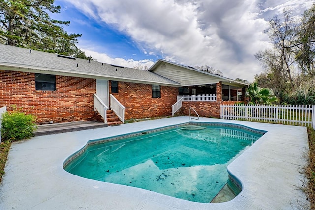 view of swimming pool with a fenced in pool, entry steps, a patio area, and fence