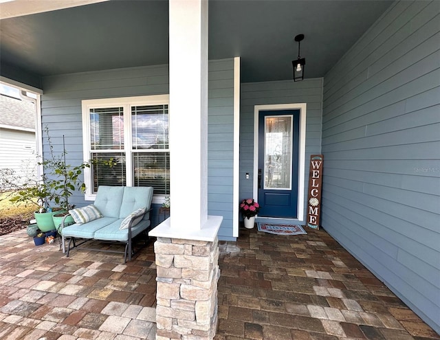 entrance to property featuring covered porch