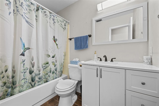 full bath with toilet, wood finished floors, vanity, visible vents, and shower / bath combo with shower curtain