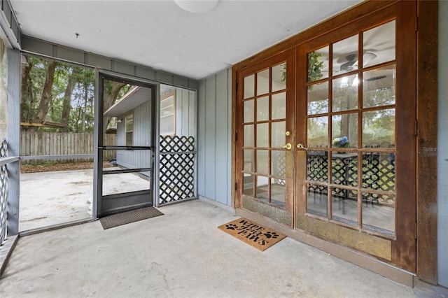 entryway with french doors and concrete floors