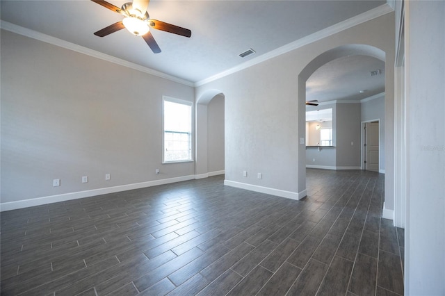 spare room with a ceiling fan, baseboards, arched walkways, and dark wood-style flooring