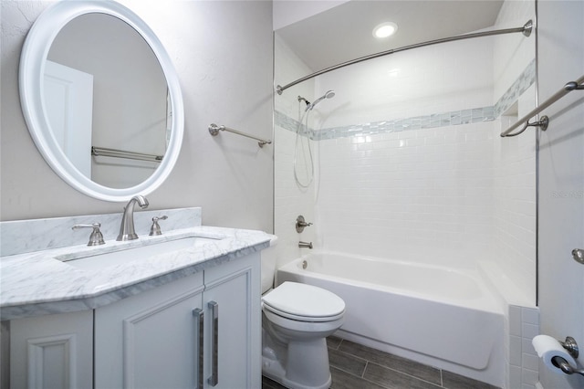 full bath with toilet, vanity, and shower / bathtub combination