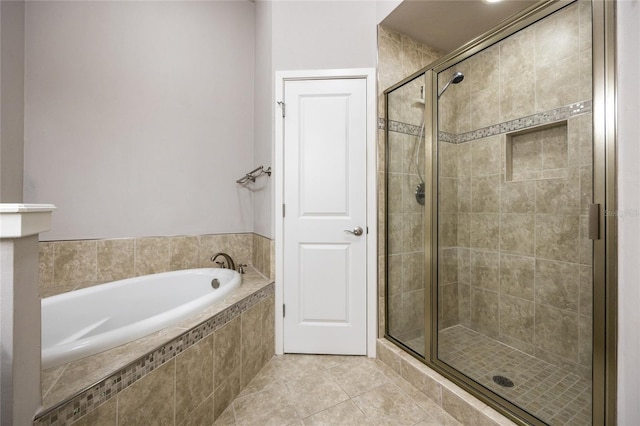 full bath with tile patterned flooring, a shower stall, and a bath