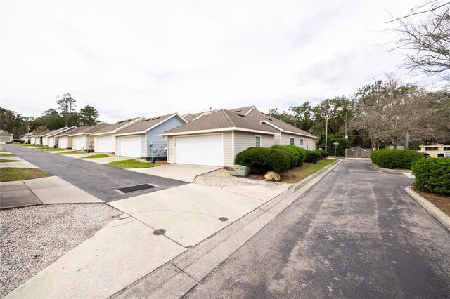 view of front of house featuring a garage and a residential view