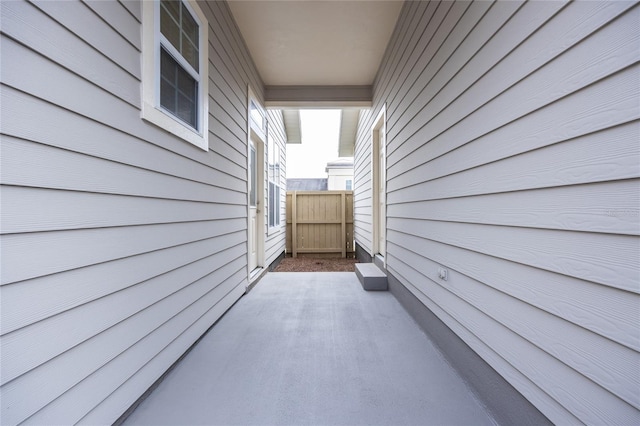 view of side of property with a patio area and fence