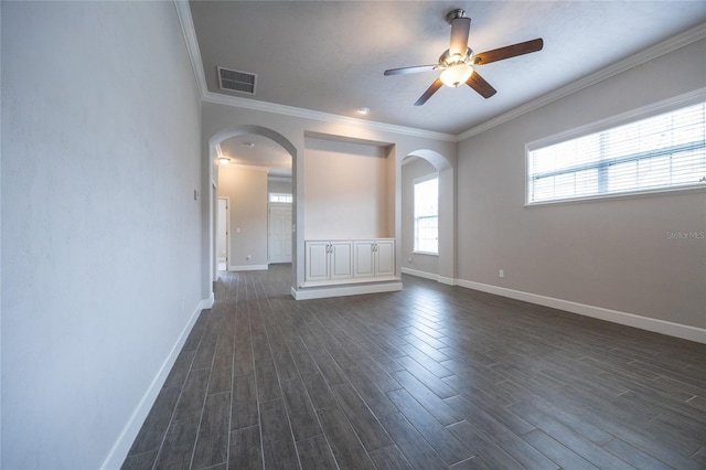 7625 SW 24th Ln, Gainesville, FL 32608 - spare room featuring arched walkways, ceiling fan, dark wood-type flooring, baseboards, and ornamental molding