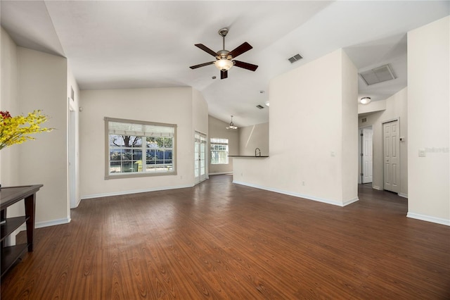 unfurnished living room featuring lofted ceiling, ceiling fan, dark wood-style flooring, visible vents, and baseboards