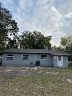 rear view of house with cooling unit