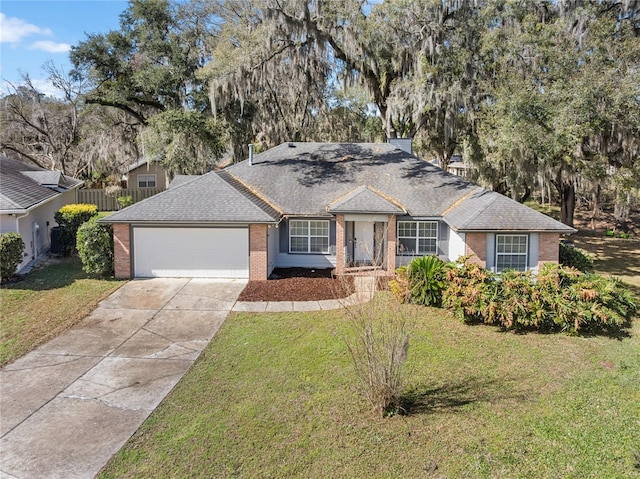 ranch-style home with a front yard, brick siding, driveway, and an attached garage