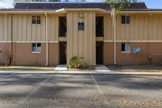 view of property with uncovered parking