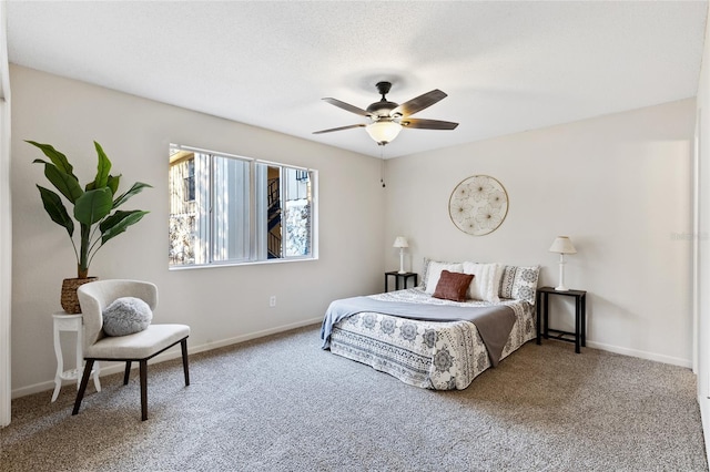 carpeted bedroom featuring ceiling fan, a textured ceiling, and baseboards