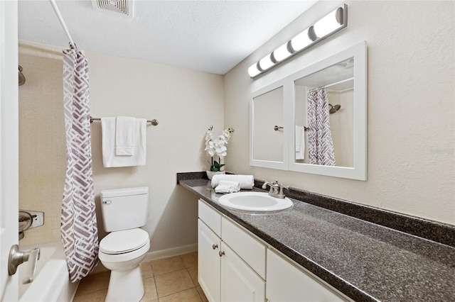 full bathroom with visible vents, toilet, vanity, tile patterned flooring, and baseboards