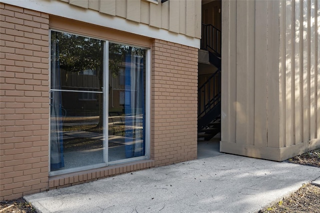 property entrance with brick siding