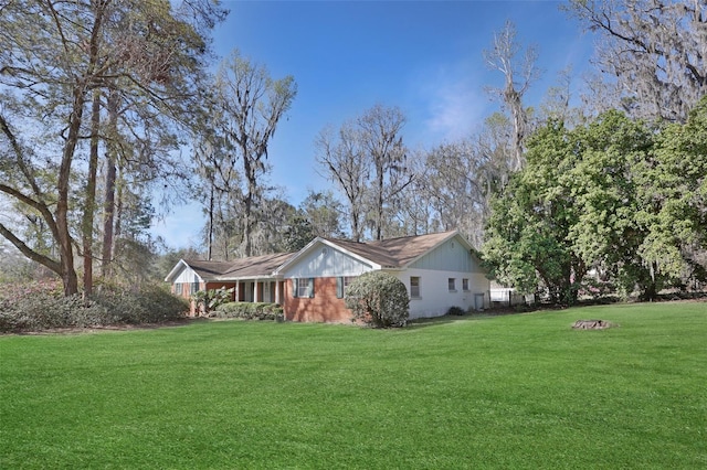 view of property exterior with a yard