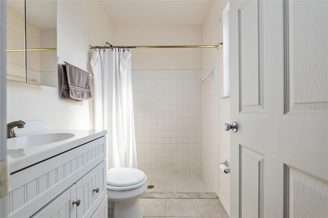 bathroom with vanity, tile patterned flooring, toilet, and a shower stall