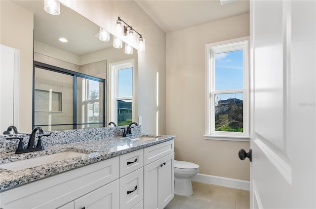 full bathroom with a stall shower, plenty of natural light, and a sink