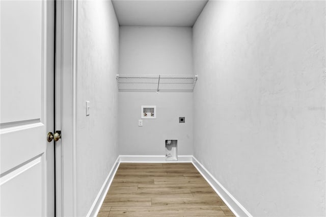 washroom with laundry area, baseboards, light wood-type flooring, washer hookup, and electric dryer hookup