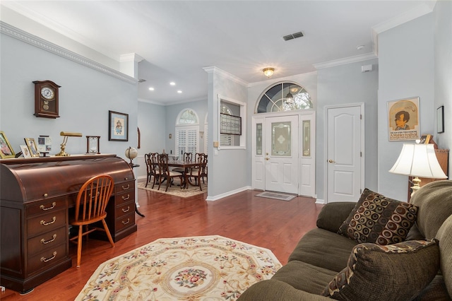 entryway featuring dark wood-style floors, visible vents, and crown molding