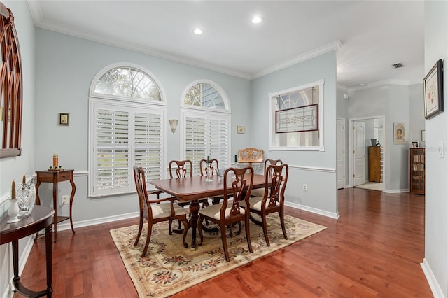 dining space featuring recessed lighting, wood finished floors, visible vents, baseboards, and crown molding