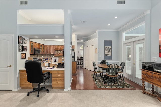 interior space featuring visible vents, ornamental molding, and french doors