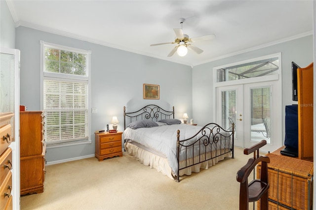 carpeted bedroom with ornamental molding, access to outside, french doors, and multiple windows