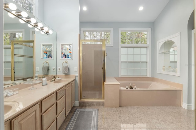 full bath featuring double vanity, granite finish floor, a sink, a shower stall, and a bath