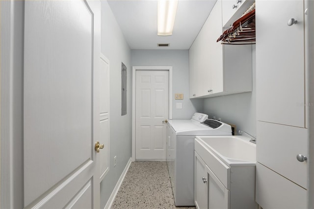 laundry room with visible vents, washing machine and clothes dryer, cabinet space, and baseboards