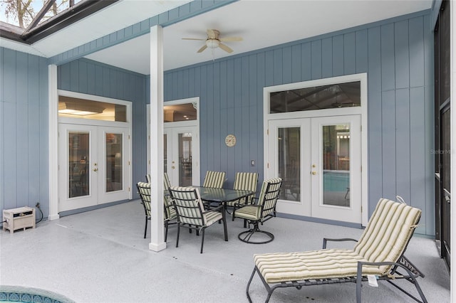 view of patio / terrace featuring a ceiling fan, french doors, and outdoor dining area