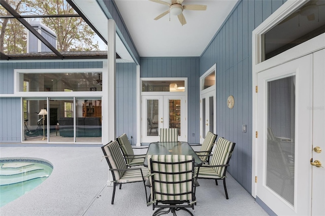 sunroom with ceiling fan and french doors