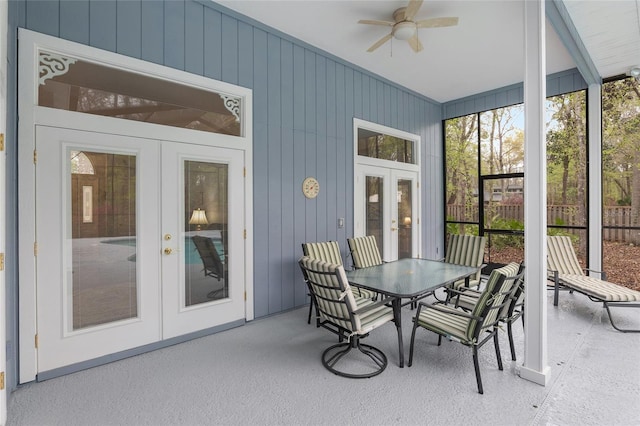 sunroom featuring french doors, a healthy amount of sunlight, and ceiling fan