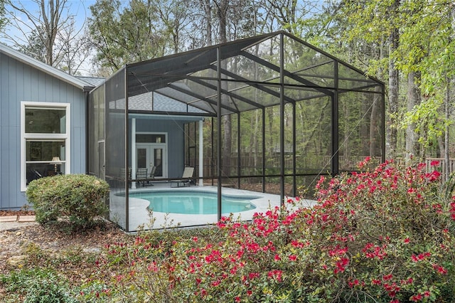 outdoor pool with glass enclosure and french doors