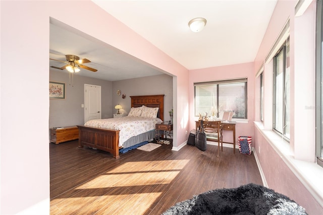 bedroom featuring baseboards and wood finished floors