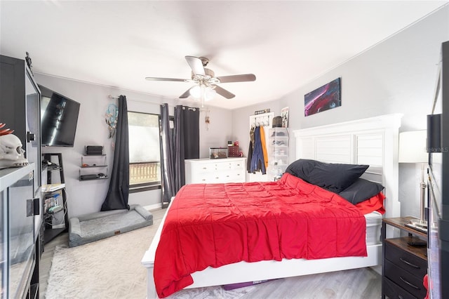 bedroom with ceiling fan and wood finished floors