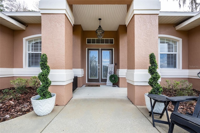 doorway to property with stucco siding