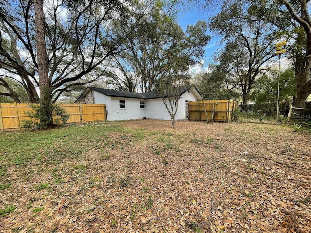 view of yard with a fenced backyard