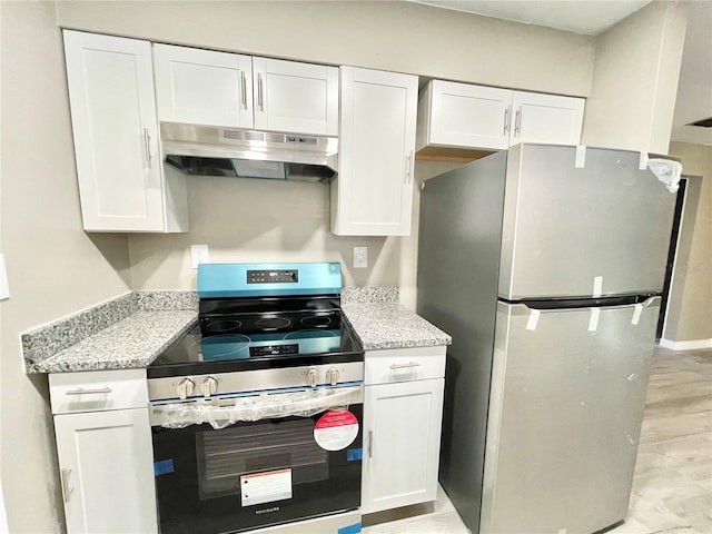 kitchen featuring stainless steel appliances, light stone counters, white cabinetry, and under cabinet range hood