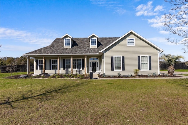 view of front of property with a front yard and fence