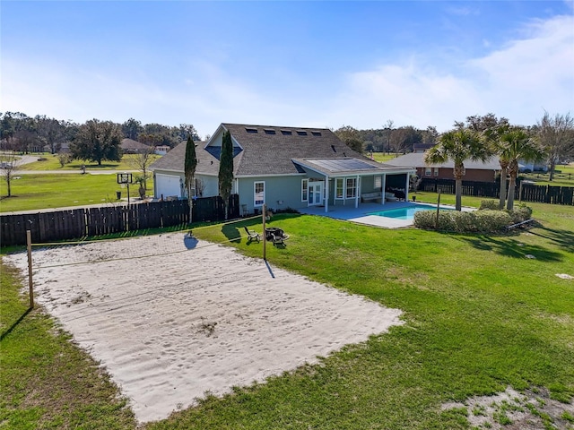 surrounding community with a yard, a pool, fence, and volleyball court