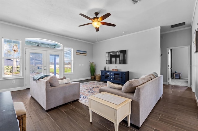 living room with visible vents, baseboards, wood tiled floor, crown molding, and french doors