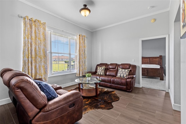 living area featuring baseboards, wood tiled floor, and crown molding