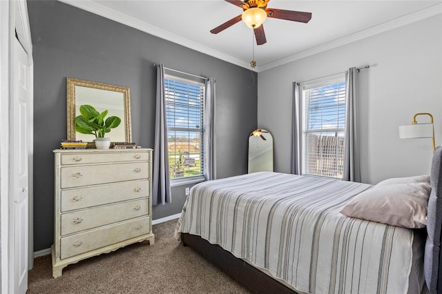 bedroom featuring dark colored carpet, ornamental molding, a ceiling fan, and baseboards